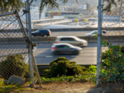 Freeway through broken gate