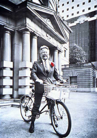 Bud Clark astride a bike