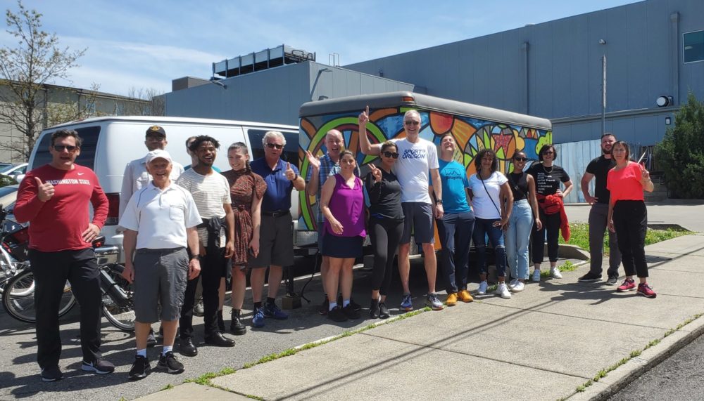 Civic leaders lined up side by side for group shot in sunshine